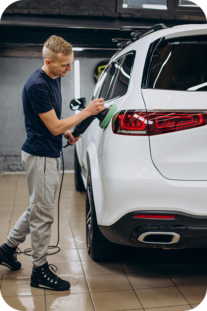 Technician detailing a car interior with precision